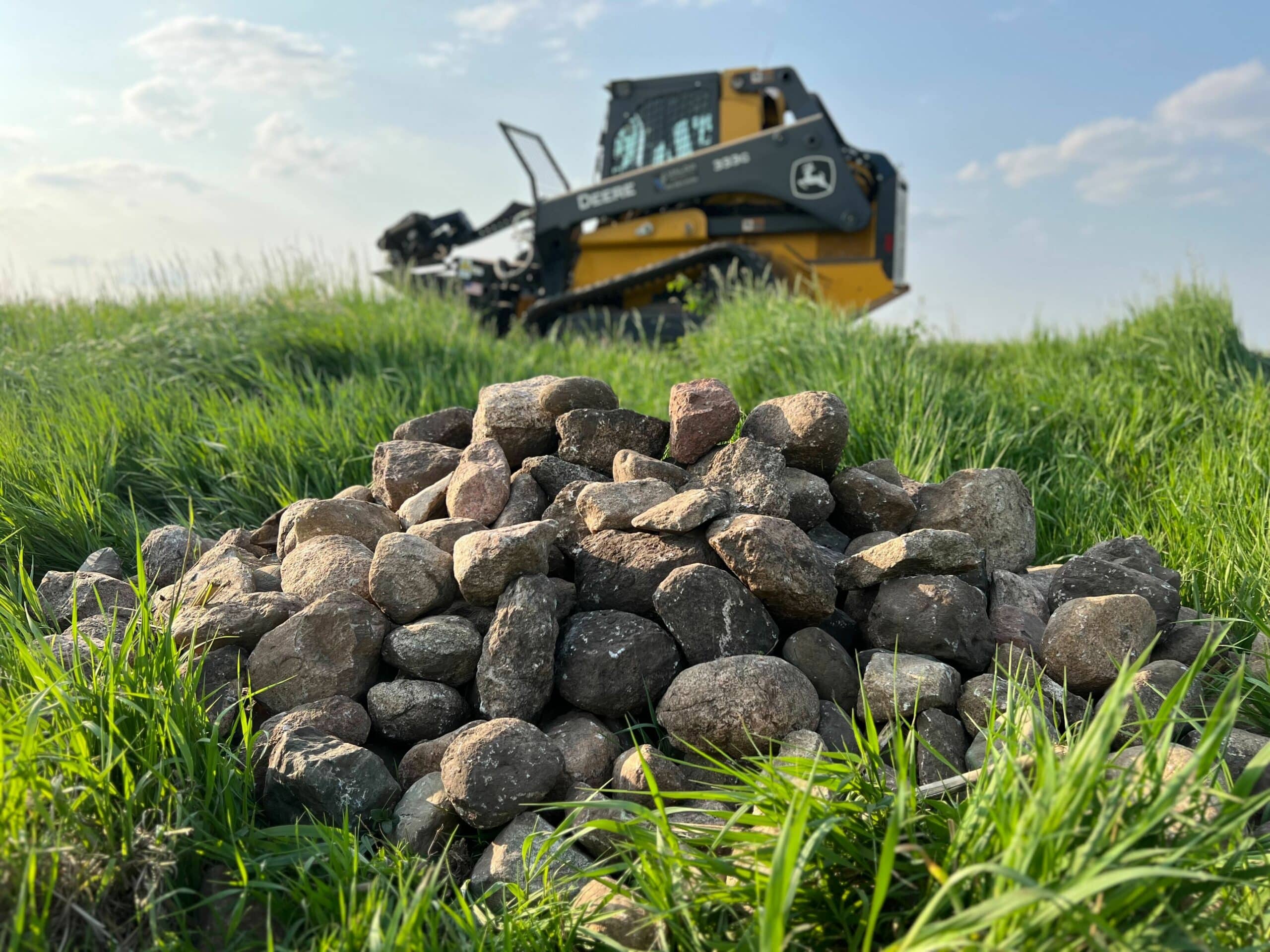 Rock pile with rock picker