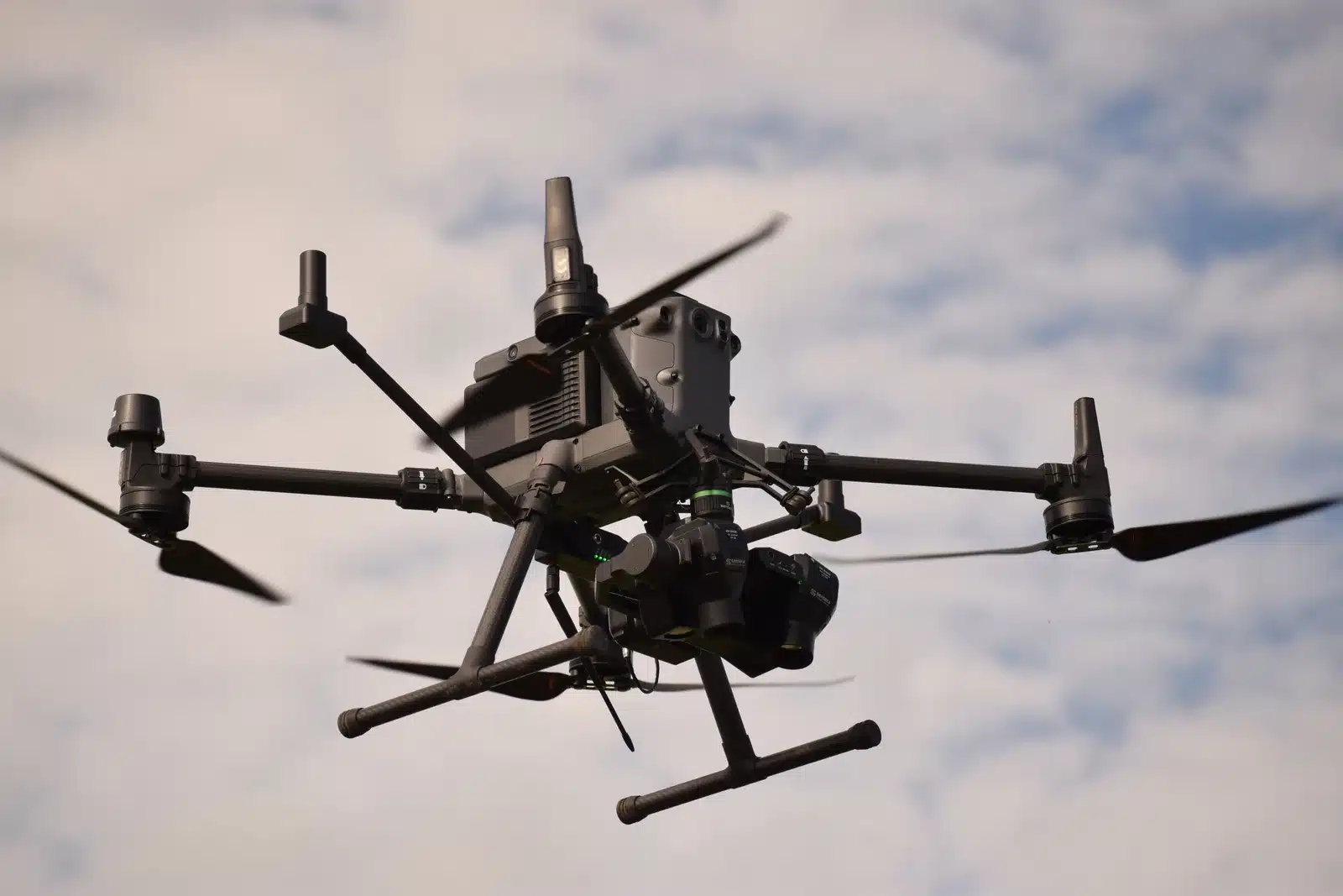 DJI Matrice RTK mapping drone in flight, used to capture imagery for fall stone picking with a TerraClear Rock Map