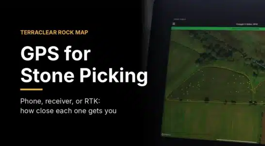 Tablet in a tractor cab showing a TerraClear Rock Map, used for GPS-guided stone picking